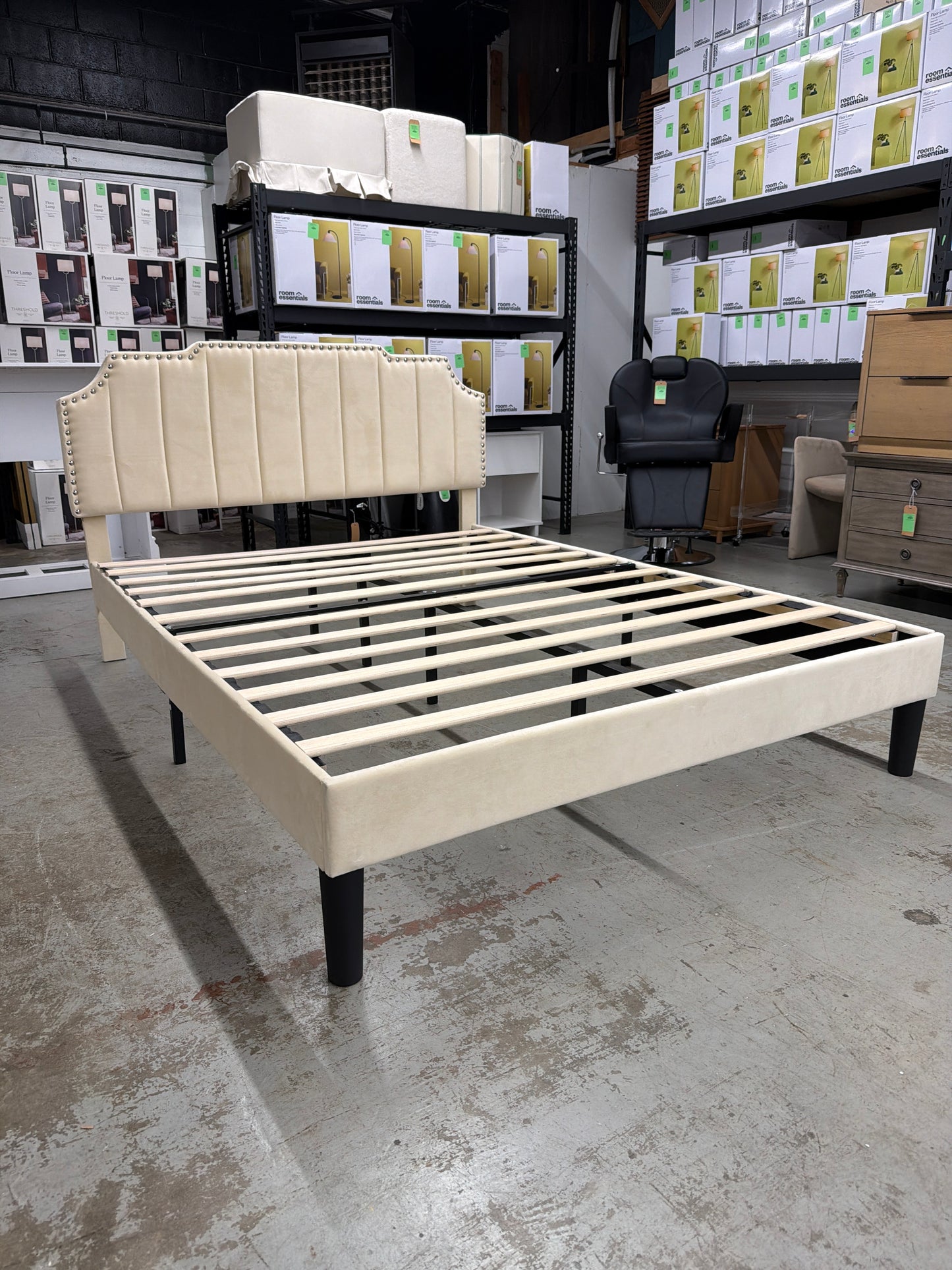 Queen-sized cream upholstered bed