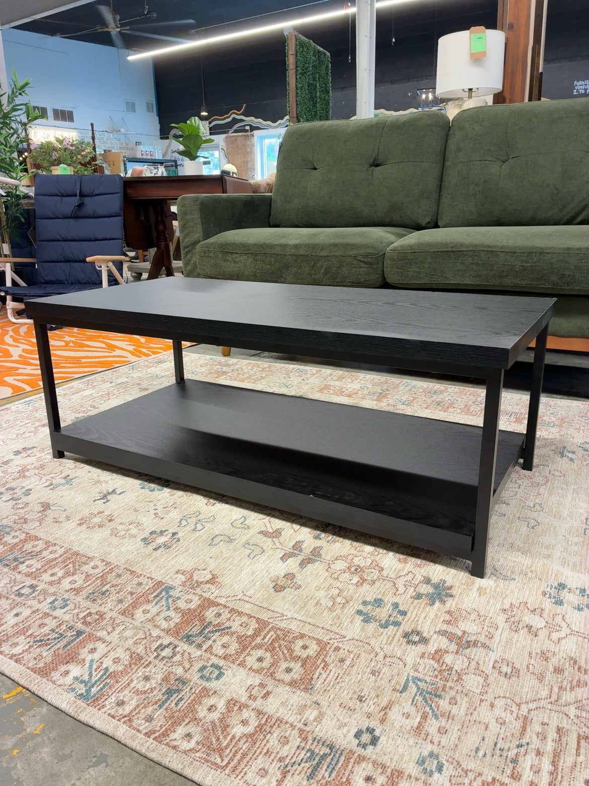 Black coffee table with storage shelf