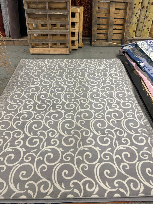 7 x 10 grey & cream rug - as is with 3-4” flaw on side