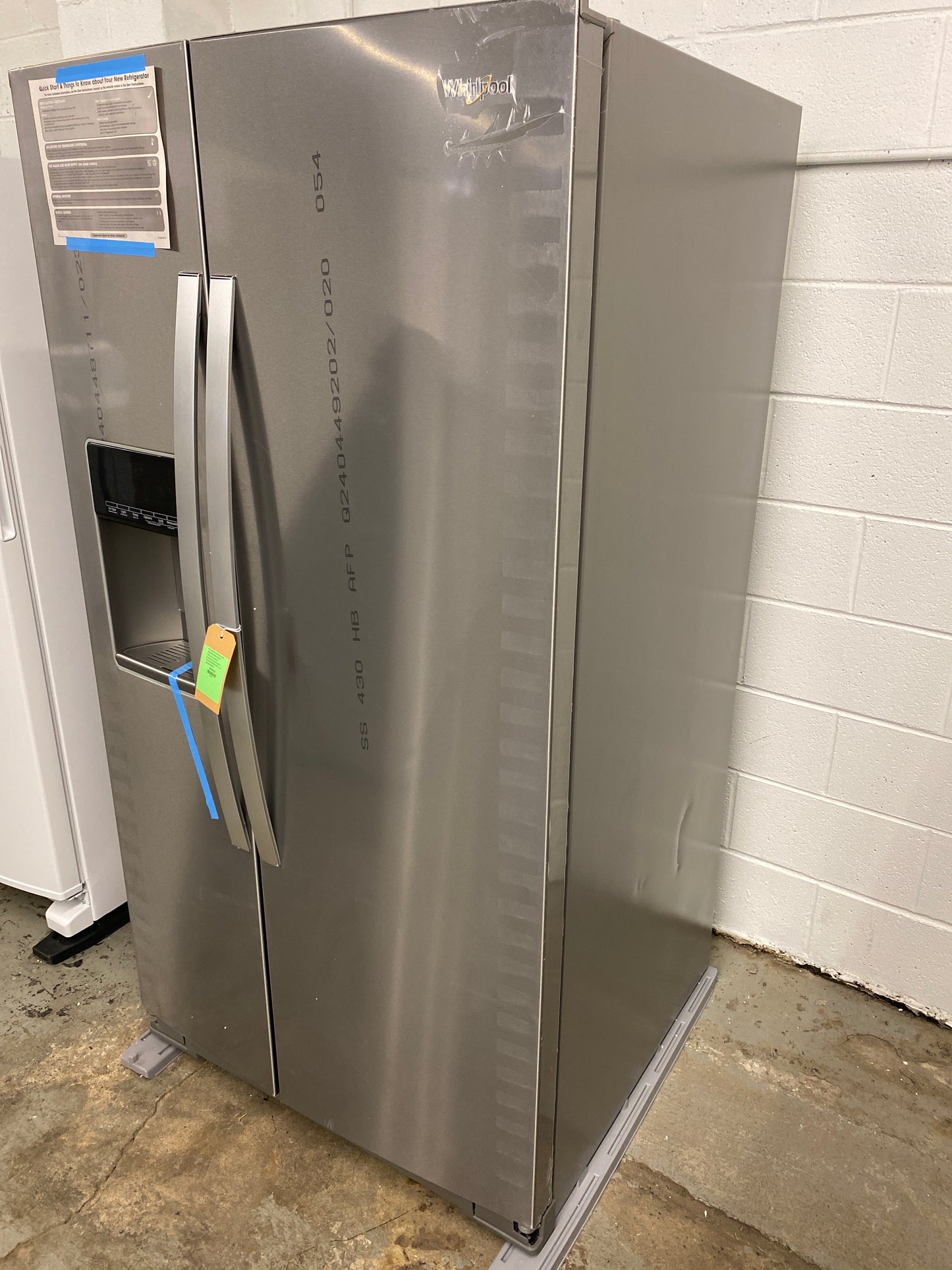 Whirlpool 28.4-cu ft Side-by-Side Refrigerator with Ice Maker, Water and Ice Dispenser (Fingerprint Resistant Stainless Steel) SCRATCH AND DENT on one side Retail: $2099