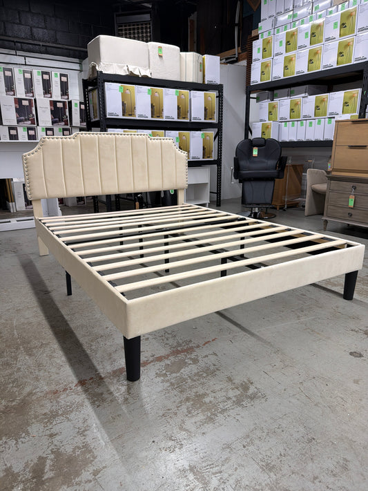 Queen-sized cream upholstered bed