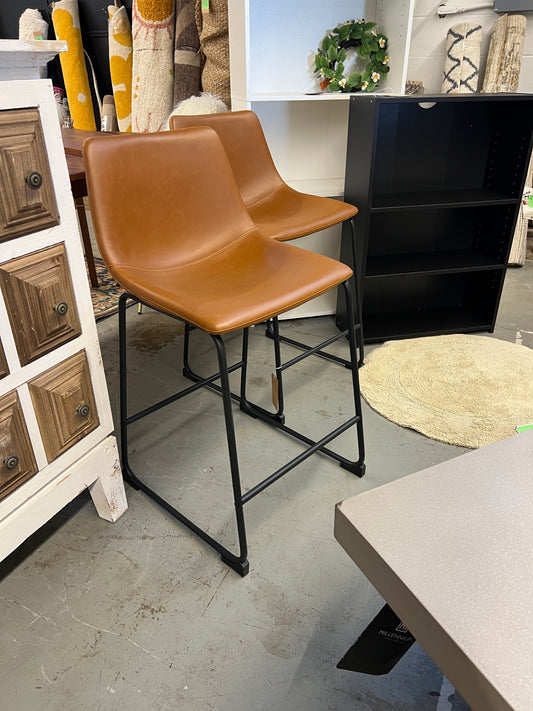24in Industrial Faux Leather Counter Stools, Set of 2 - Brown | Dimensions: 34.5in H x 18in L x 22in W | Weight: 14 LBS | Retail Price: $216