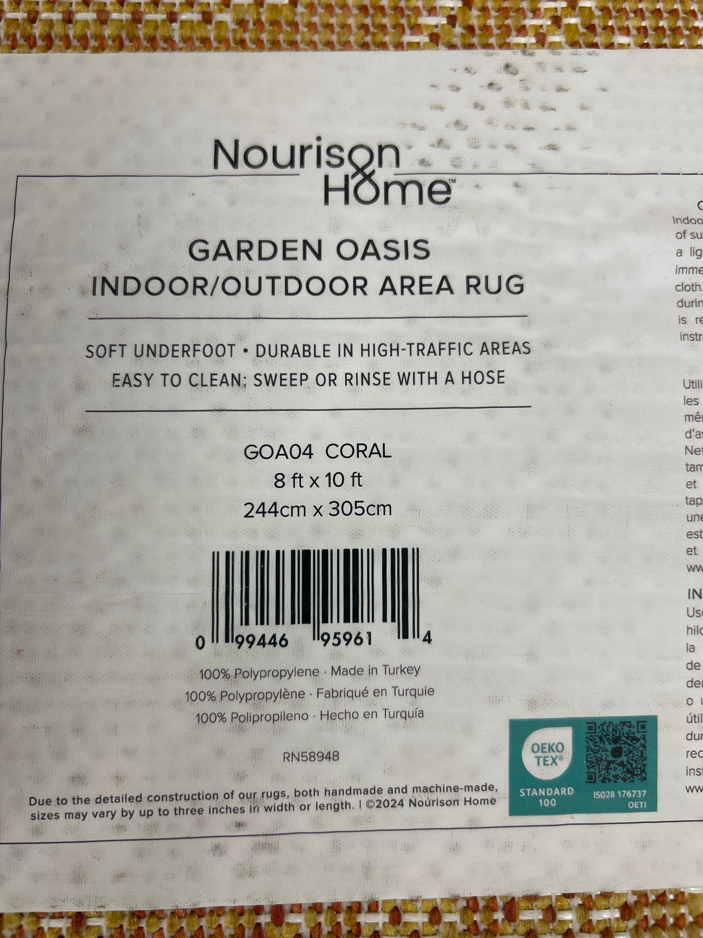 8 x 10 golden coral area rug - by Nourison - indoor/outdoor - as is (fraying on one small section)
