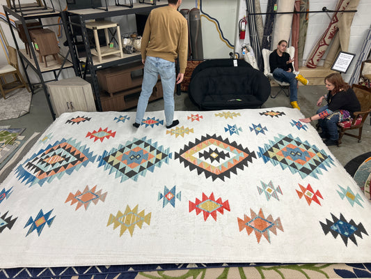 9 x 13 Native-themed area rug - as is with minor flaws (dirty edge)