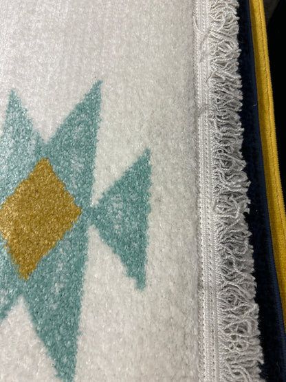 9 x 13 Native-themed area rug - as is with minor flaws (dirty edge)