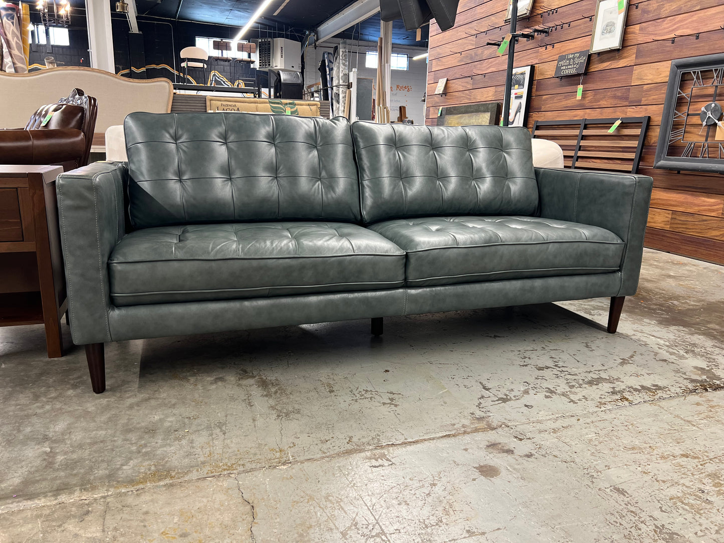 Harstine Sofa Green  SIGNS OF WEAR