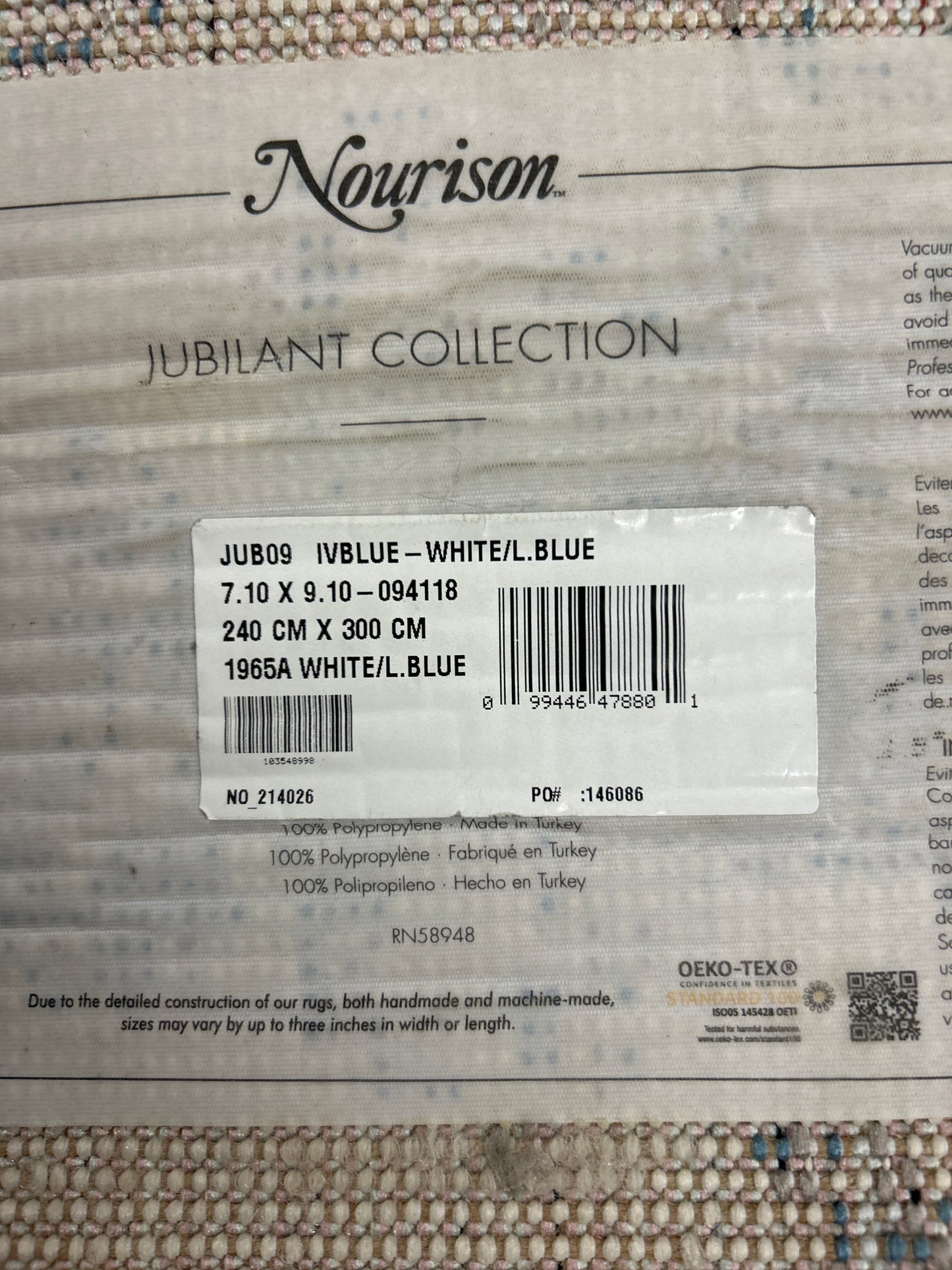 8 x 10 ivory and blue area rug ￼- as is (minor fraying on some edges)