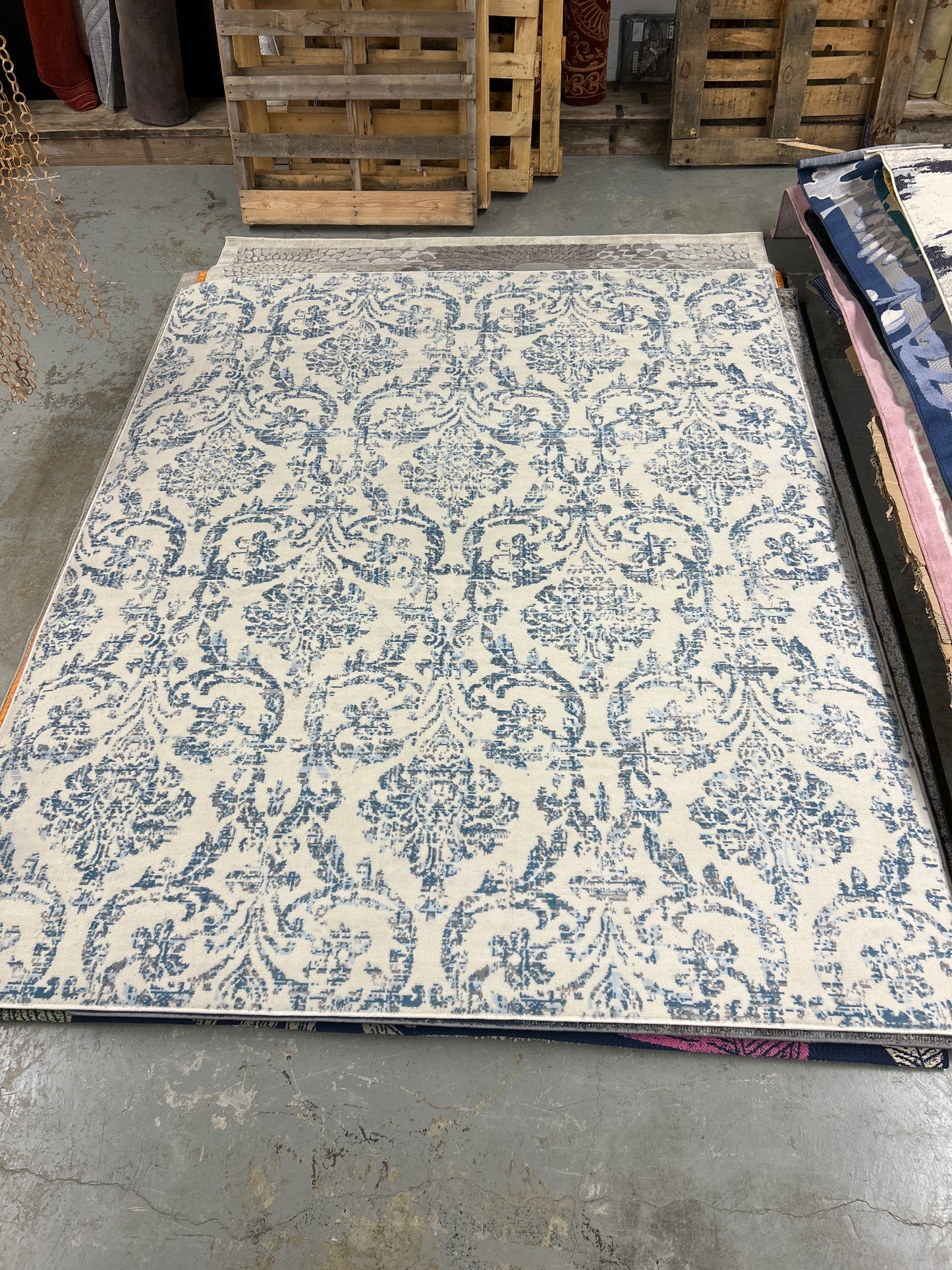 8 x 10 ivory and blue area rug ￼- as is (minor fraying on some edges)