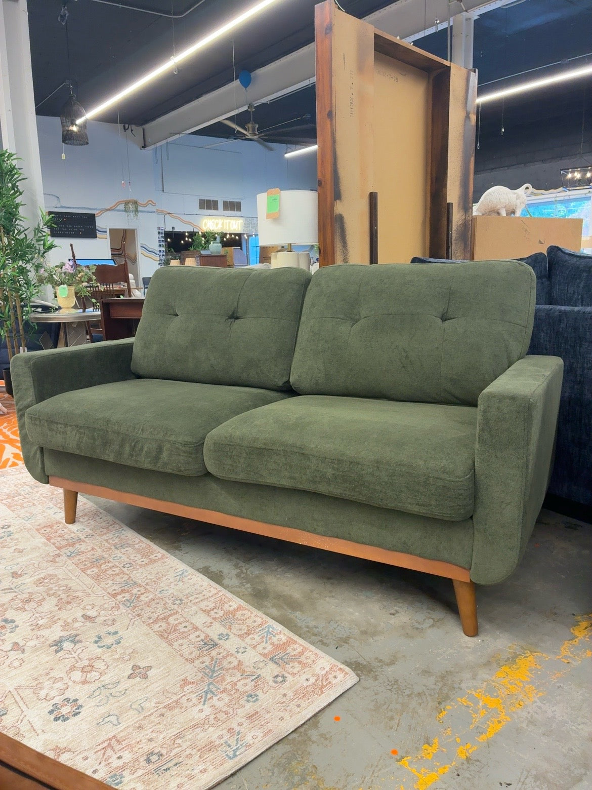 Olive green mid-century style loveseat