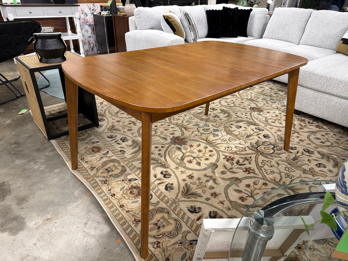 Walnut Astrid dining table on the showroom floor