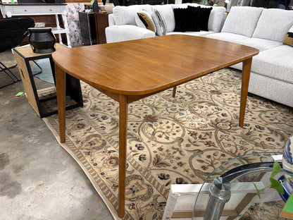 Walnut Astrid dining table on the showroom floor