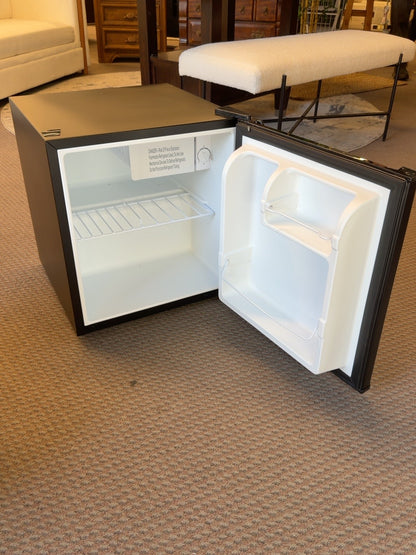 Kenmore mini fridge interior with wire shelf, door storage and small freezer compartment