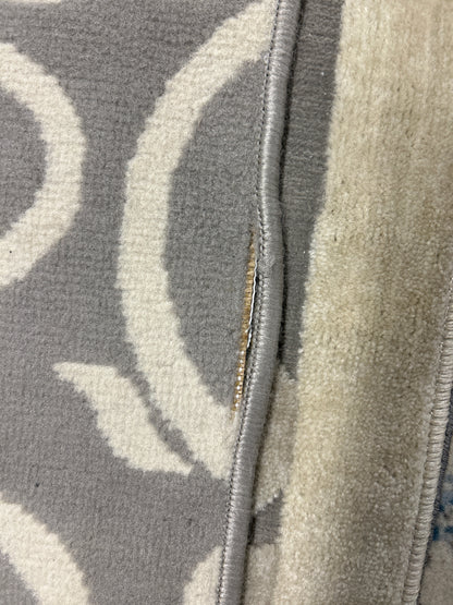 7 x 10 grey & cream rug - as is with 3-4” flaw on side