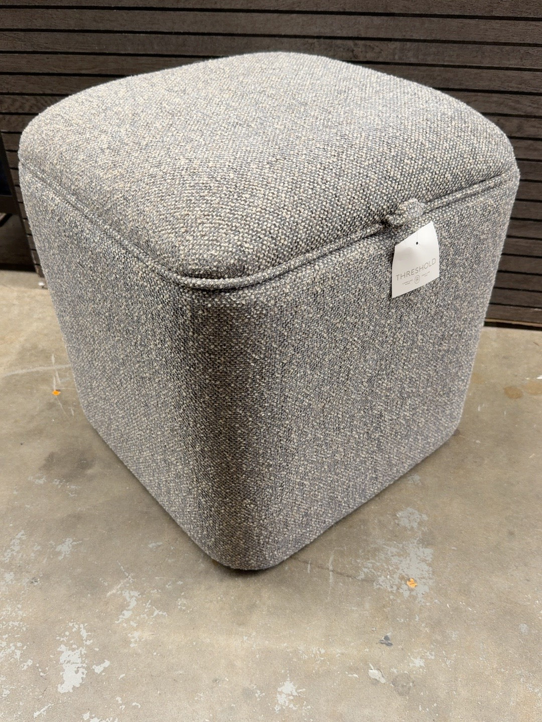 Threshold gray rounded upholstered storage cube ottoman shown closed at Ready for Good